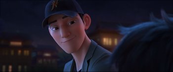 Movie still from “Big Hero 6” (2014), directed by Chris Williams – A person wearing a baseball cap; Close Up shot, Over the shoulder angle