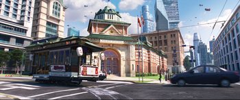 Movie still from “Big Hero 6” (2014), directed by Chris Williams – An image of a train going down the street; Extreme Wide shot, High angle