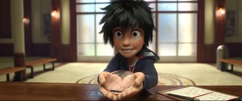Movie still from “Big Hero 6” (2014), directed by Chris Williams – A boy is holding a bowl in his hands; Close Up shot, Overhead angle
