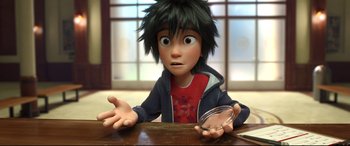 Movie still from “Big Hero 6” (2014), directed by Chris Williams – A boy sitting at a table with a bowl in front of him; Close Up shot, High angle