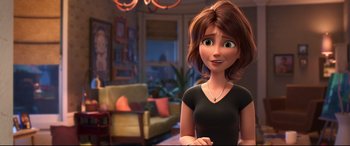 Movie still from “Big Hero 6” (2014), directed by Chris Williams – A woman is standing in front of a living room; Close Up shot, Over the shoulder angle