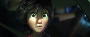 Movie still from “Big Hero 6” (2014), directed by Chris Williams – A person's face with big brown eyes; Close Up shot, Over the shoulder angle