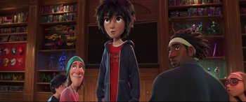 Movie still from “Big Hero 6” (2014), directed by Chris Williams – A group of people standing around a room; Medium shot, Over the shoulder angle