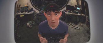 Movie still from “Big Hero 6” (2014), directed by Chris Williams – An animated character is holding a piece of paper in front of him; Close Up shot, High angle