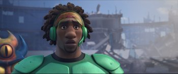 Movie still from “Big Hero 6” (2014), directed by Chris Williams – A man with dreadlocks wearing headphones and a green outfit; Close Up shot, Low angle