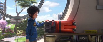 Movie still from “Big Hero 6” (2014), directed by Chris Williams – A young boy standing next to a red suitcase; Medium shot, Over the shoulder angle
