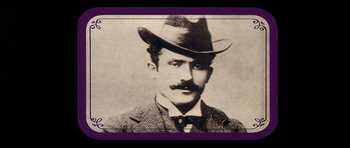 Movie still from “Big Jake” (1971), directed by George Sherman – An old photo of a man wearing a hat; Close Up shot, Low angle