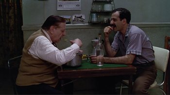 Movie still from “Big Night” (1996), directed by Stanley Tucci – Two men are sitting at a table and eating; Medium shot, High angle
