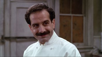 A person wearing a chef's outfit