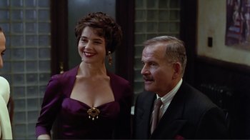 Movie still from “Big Night” (1996), directed by Stanley Tucci – A man and a woman standing next to each other; Medium shot, Low angle
