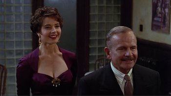 Movie still from “Big Night” (1996), directed by Stanley Tucci – A man and a woman standing next to each other; Medium shot, Low angle