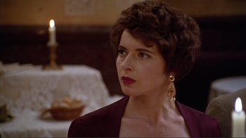 Movie still from “Big Night” (1996), directed by Stanley Tucci – A person wearing a suit and tie; Close Up shot, Over the shoulder angle