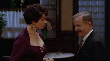 Movie still from “Big Night” (1996), directed by Stanley Tucci – A man and a woman talking to each other; Medium shot, Over the shoulder angle