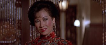 Movie still from “Big Trouble in Little China” (1986), directed by John Carpenter – A person wearing an oriental dress; Close Up shot, Low angle