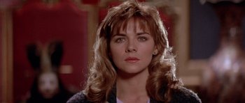 Movie still from “Big Trouble in Little China” (1986), directed by John Carpenter – A person with long hair; Close Up shot, Over the shoulder angle