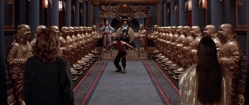Movie still from “Big Trouble in Little China” (1986), directed by John Carpenter – A man is skateboarding in the middle of a room; Extreme Wide shot, High angle