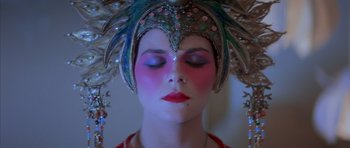 Movie still from “Big Trouble in Little China” (1986), directed by John Carpenter – A person wearing a costume; Close Up shot, Overhead angle