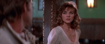 Movie still from “Big Trouble in Little China” (1986), directed by John Carpenter – A person with long hair; Close Up shot, Over the shoulder angle