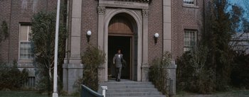 Movie still from “Bigger Than Life” (1956), directed by Nicholas Ray – A man walking down the steps of a building; Wide shot, Low angle
