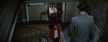 Movie still from “Bigger Than Life” (1956), directed by Nicholas Ray – A woman and a boy in a room; Wide shot, High angle