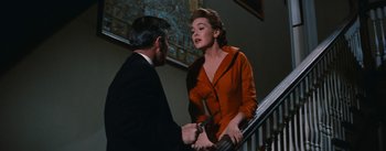 Movie still from “Bigger Than Life” (1956), directed by Nicholas Ray – A man and a woman on a stair case; Medium shot, Low angle
