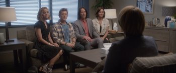 Movie still from “Bill & Ted Face the Music” (2020), directed by Dean Parisot – A group of people sitting in a living room; Wide shot, Over the shoulder angle