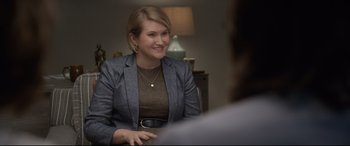 Movie still from “Bill & Ted Face the Music” (2020), directed by Dean Parisot – A woman sitting in front of a man in front of a lamp; Medium shot, Over the shoulder angle