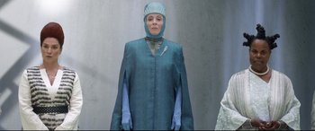 Movie still from “Bill & Ted Face the Music” (2020), directed by Dean Parisot – A woman wearing a surgical gown and a mask; Medium shot, Low angle