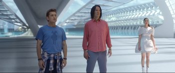 Movie still from “Bill & Ted Face the Music” (2020), directed by Dean Parisot – Two men standing next to each other in an empty room; Medium shot, Low angle