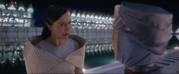 Movie still from “Bill & Ted Face the Music” (2020), directed by Dean Parisot – Two women are talking in front of an illuminated wall; Close Up shot, Over the shoulder angle