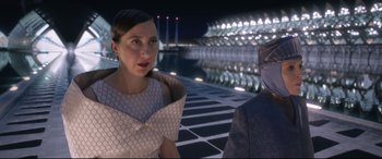 Movie still from “Bill & Ted Face the Music” (2020), directed by Dean Parisot – A woman in a white dress talking to a man in a white suit; Medium shot, Over the shoulder angle