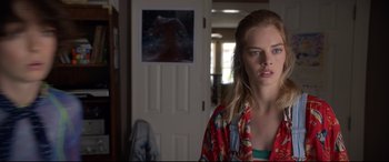 Movie still from “Bill & Ted Face the Music” (2020), directed by Dean Parisot – A young woman standing in front of a door; Close Up shot, Over the shoulder angle