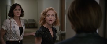 Movie still from “Bill & Ted Face the Music” (2020), directed by Dean Parisot – A woman in a black dress looking at a mirror; Close Up shot, Over the shoulder angle