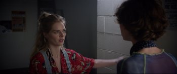 Movie still from “Bill & Ted Face the Music” (2020), directed by Dean Parisot – A woman in a red shirt is talking to a man; Medium shot, Over the shoulder angle