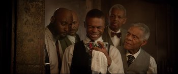 Movie still from “Bill & Ted Face the Music” (2020), directed by Dean Parisot – A group of men standing next to each other; Medium shot, Low angle