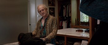 Movie still from “Bill & Ted Face the Music” (2020), directed by Dean Parisot – A man in a leopard print shirt in front of a mirror; Medium shot, Over the shoulder angle