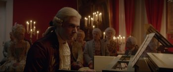 Movie still from “Bill & Ted Face the Music” (2020), directed by Dean Parisot – A group of people standing in a room with a laptop computer; Medium shot, Low angle