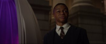 Movie still from “Bill & Ted Face the Music” (2020), directed by Dean Parisot – A man wearing a suit and tie in a dark room; Close Up shot, Low angle