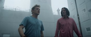 Movie still from “Bill & Ted Face the Music” (2020), directed by Dean Parisot – Two men standing next to each other on a foggy day; Medium shot, Low angle