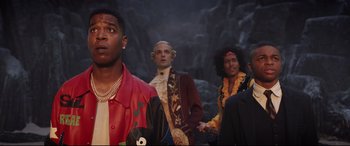 Movie still from “Bill & Ted Face the Music” (2020), directed by Dean Parisot – A group of men standing next to each other; Medium shot, Low angle