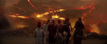 Movie still from “Bill & Ted Face the Music” (2020), directed by Dean Parisot – A group of people looking at a volcano; Extreme Wide shot, High angle