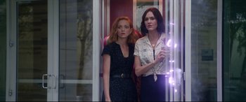 Movie still from “Bill & Ted Face the Music” (2020), directed by Dean Parisot – Two women standing next to each other on a train; Medium shot, Low angle