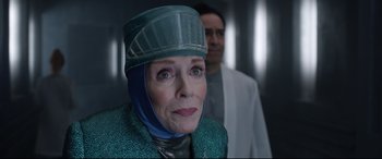 Movie still from “Bill & Ted Face the Music” (2020), directed by Dean Parisot – An older woman wearing a hat and a jacket; Close Up shot, Over the shoulder angle