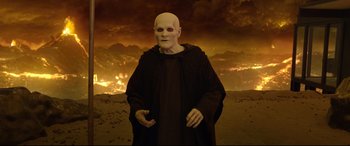 Movie still from “Bill & Ted Face the Music” (2020), directed by Dean Parisot – An old man with a bald head wearing a black robe; Medium shot, High angle