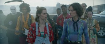 Movie still from “Bill & Ted Face the Music” (2020), directed by Dean Parisot – A group of people standing next to each other on a bridge; Medium shot, Over the shoulder angle