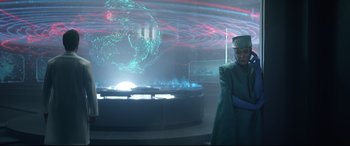 Movie still from “Bill & Ted Face the Music” (2020), directed by Dean Parisot – A man standing in front of a large screen; Wide shot, Over the shoulder angle