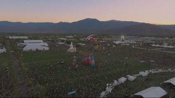Movie still from “Billie Eilish: The World's a Little Blurry” (2021), directed by R.J. Cutler – An aerial view of an outdoor festival with a lot of people; Extreme Wide shot, High angle