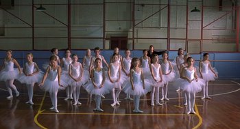 Movie still from “Billy Elliot” (2000), directed by Stephen Daldry – A group of young ballerinas posing for a picture; Wide shot, Low angle