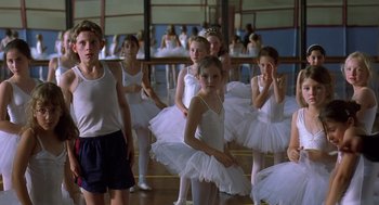 Movie still from “Billy Elliot” (2000), directed by Stephen Daldry – A group of young ballerinas standing in front of a mirror; Wide shot, Over the shoulder angle