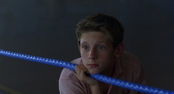 Movie still from “Billy Elliot” (2000), directed by Stephen Daldry – A young man holding a blue rope in his hands; Close Up shot, Low angle
